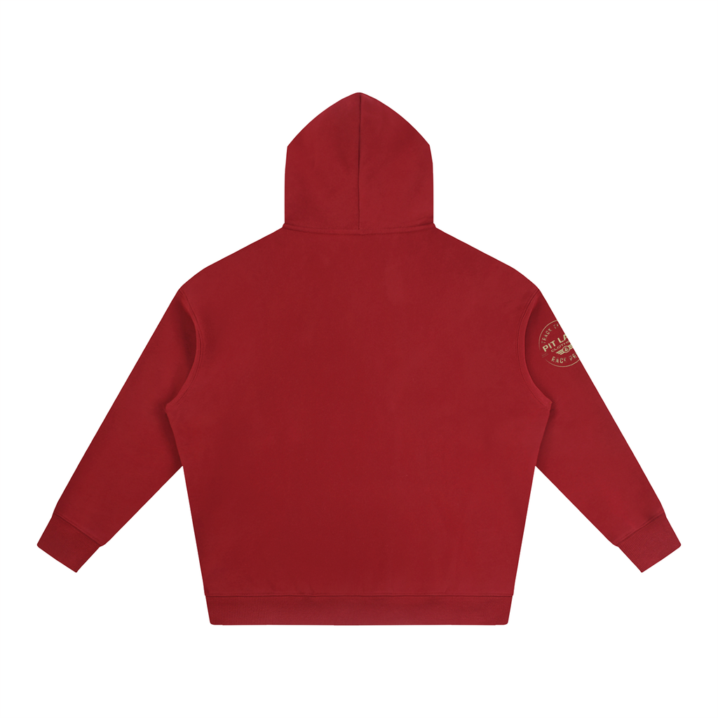 A red hooded sweatshirt shown from the back, featuring a small circular white graphic on the left sleeve, set against a plain white background.