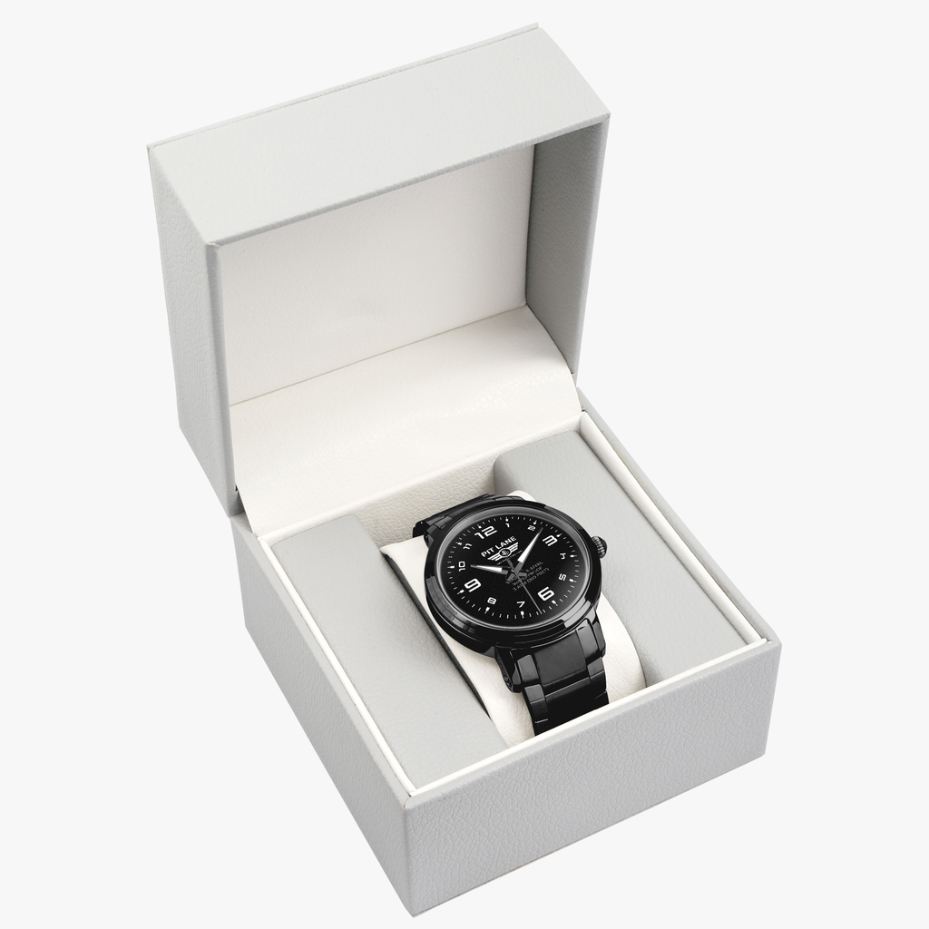 A black Pit Lane Clothing stainless steel watch with a matching black metal link bracelet, featuring a black dial with white Arabic numerals and hands, set against a neutral gray background.