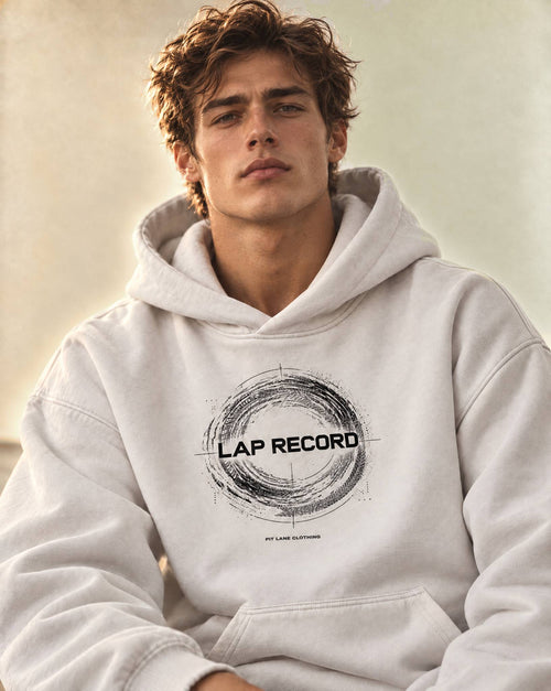 A white pullover PIT LANE CLOTHING hoodie with a distressed white graphic on the chest reading 'LAP RECORD' and smaller text below, shown on a plain white background.