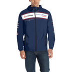 A man wearing a navy blue hooded jacket with Yokohama and Formula Ford sponsor logos across the chest, paired with blue jeans, photographed against a plain white background.