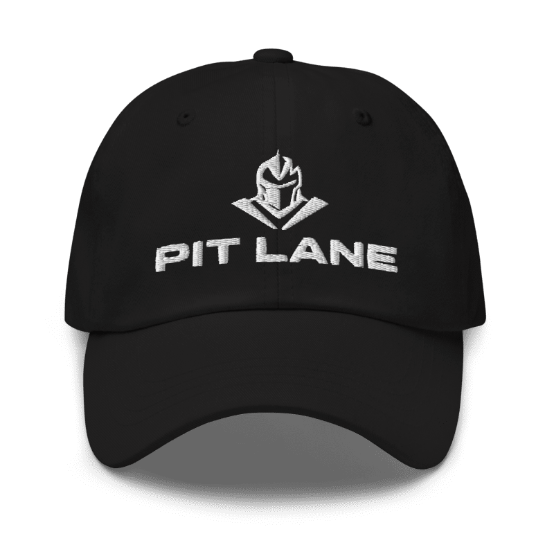A black baseball cap with a white embroidered helmet logo and the text 'PIT LANE' on the front, shown against a plain white background.