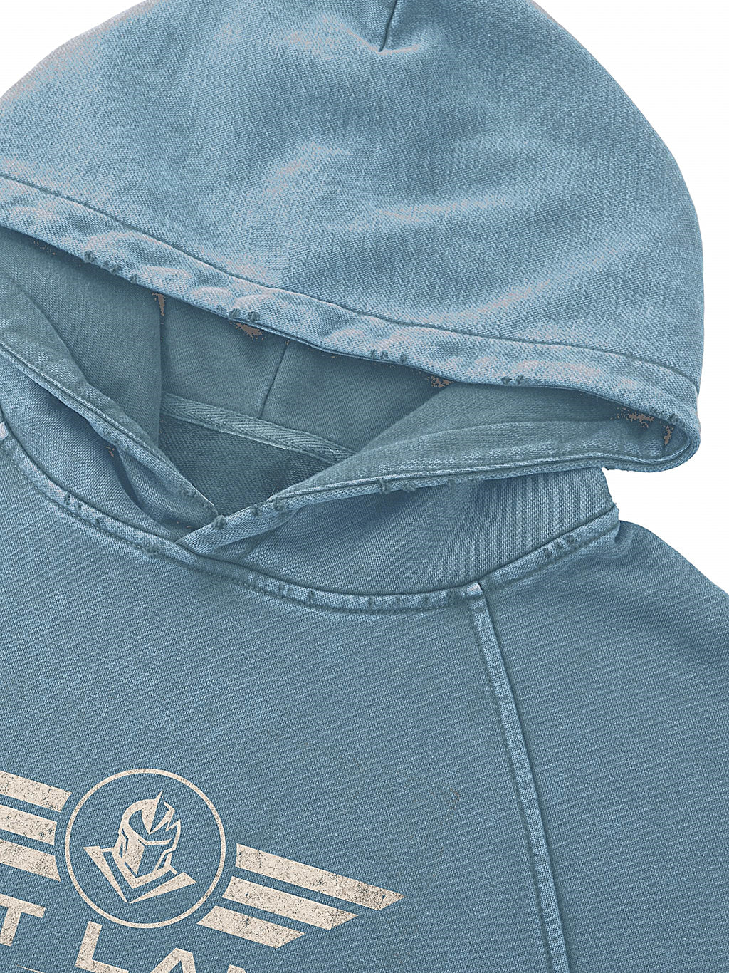 Close-up of a washed light blue hooded sweatshirt with a distressed white graphic logo on the chest, set against a plain white background.