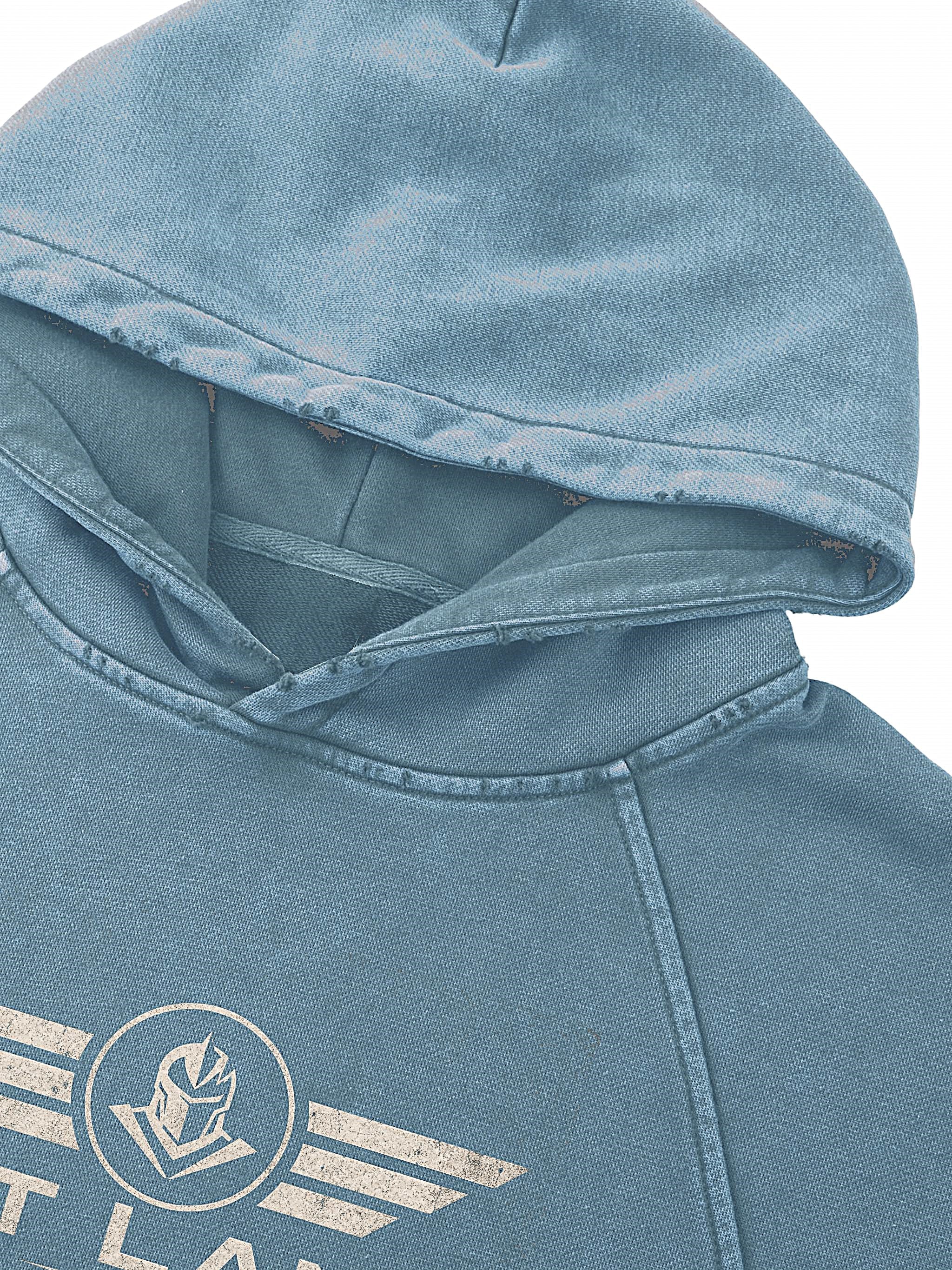 Close-up of a washed light blue hooded sweatshirt with a distressed white graphic logo on the chest, set against a plain white background.