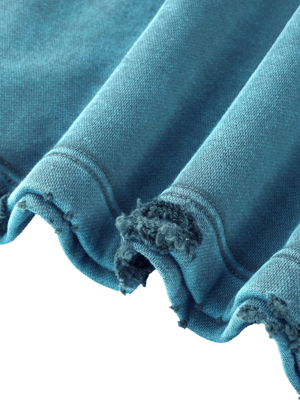 A close-up of a distressed blue fabric item, showing the ribbed cuff with frayed, ripped edges against a white background.