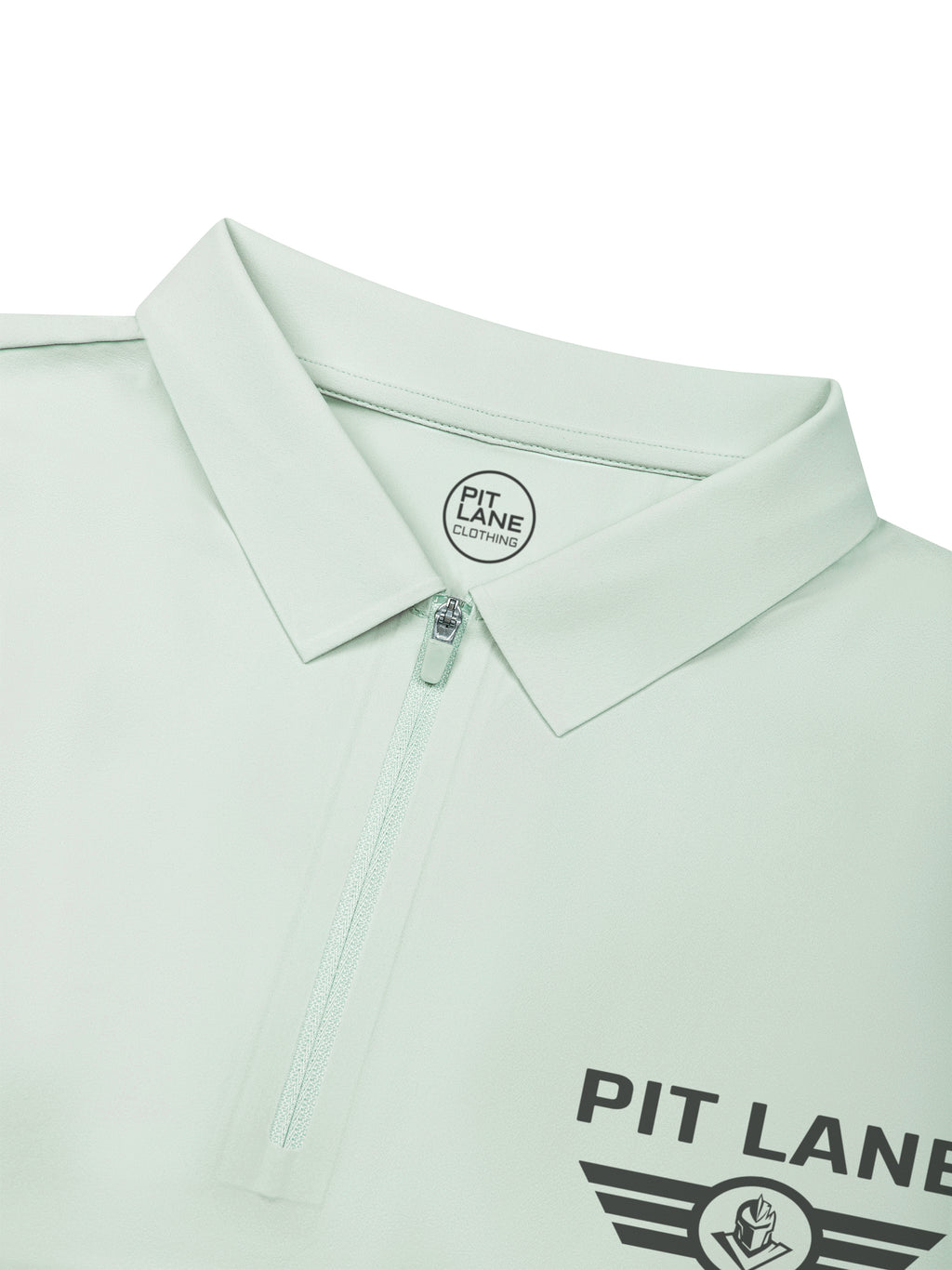 A close-up of a mint green polo shirt by Pit Lane, showing the collar, a partial zipper, and the Pit Lane logo printed on the chest.
