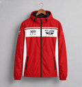 A red hooded jacket with white side panels and a black zipper, hanging on a wooden hanger against a gray background. The chest features a white stripe with '300 KPH' and 'PIT LANE  CLOTHING' branding.