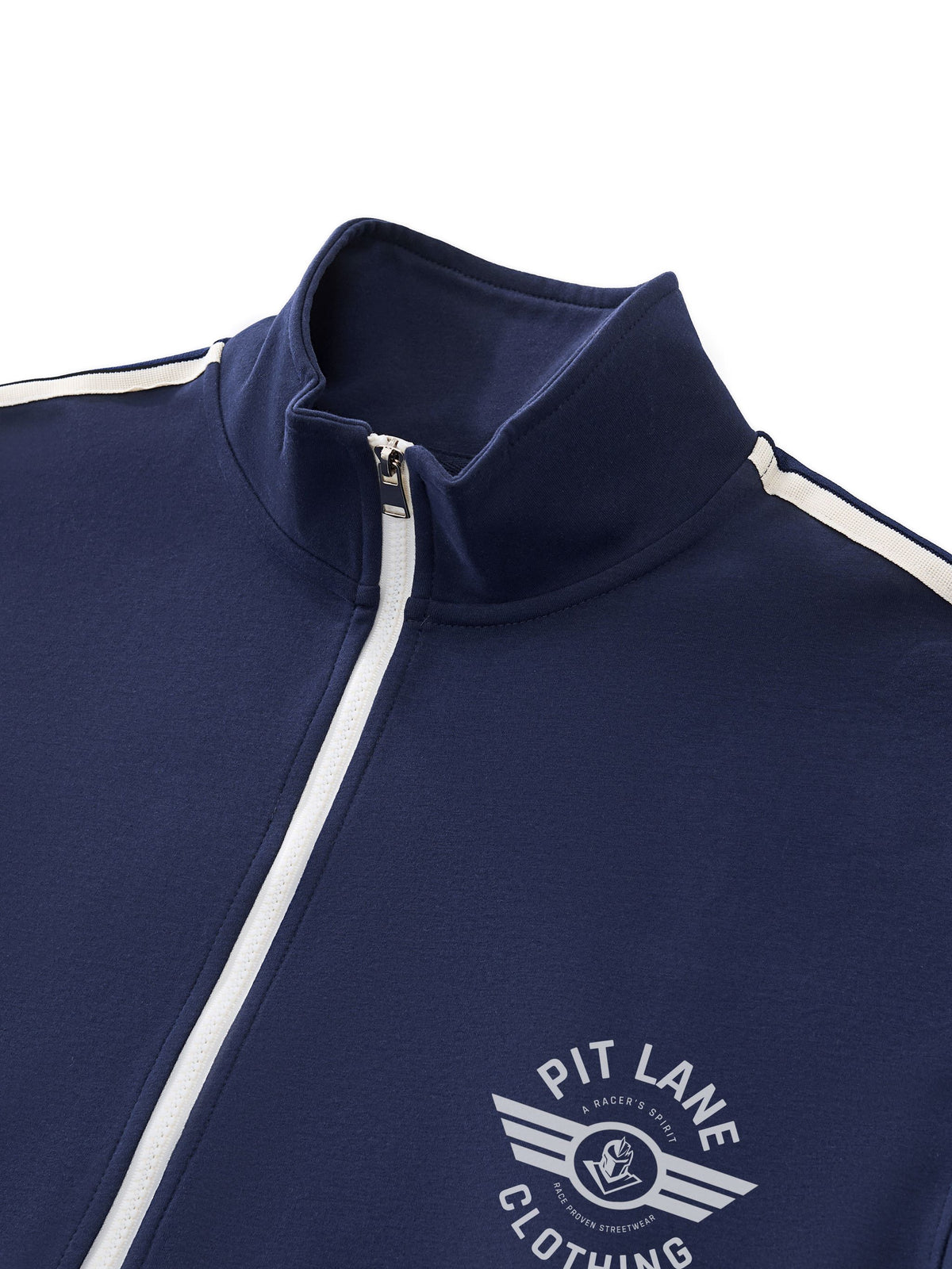 Close-up of a navy blue track jacket with a white zipper, white shoulder stripes, and a white 'PIT LANE CLOTHING' logo on the chest.