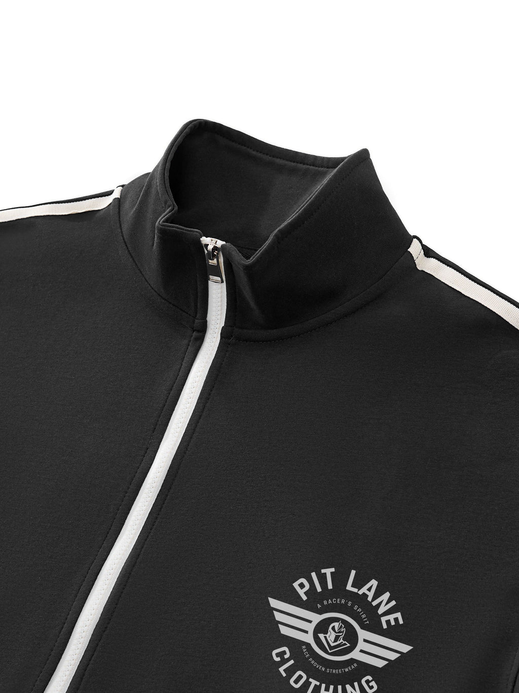 Close-up of a black zip-up track jacket with a high collar, white zipper, and white shoulder stripes. A white 'PIT LANE CLOTHING' wing logo is printed on the left chest.