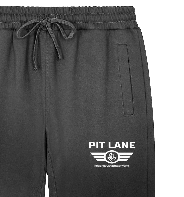Black sweatpants with a white 'PIT LANE' logo printed on the left leg, featuring an elastic drawstring waist and side pocket, shown against a plain white background.