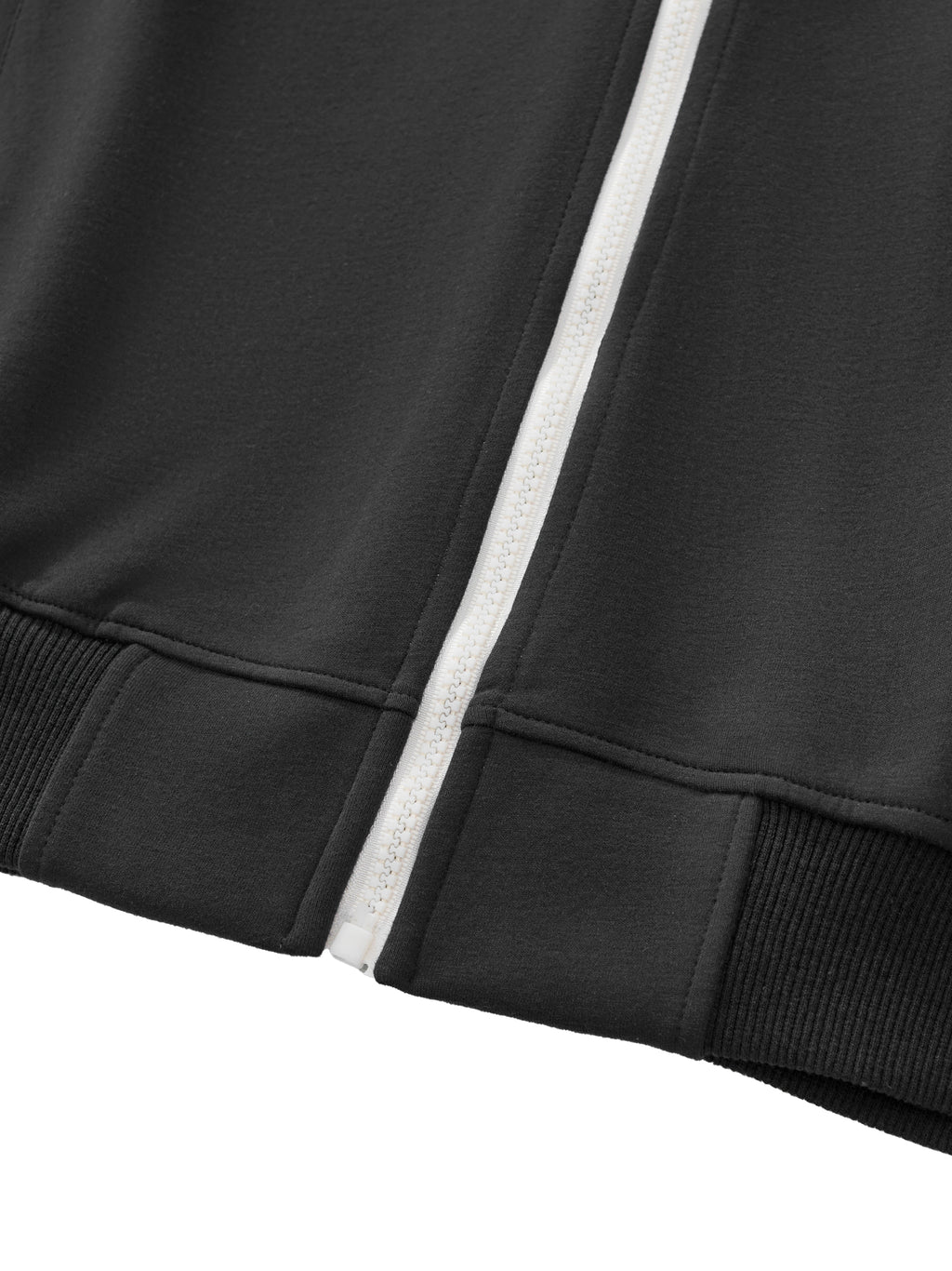 Close-up of a navy blue jacket with a white zipper on a white background