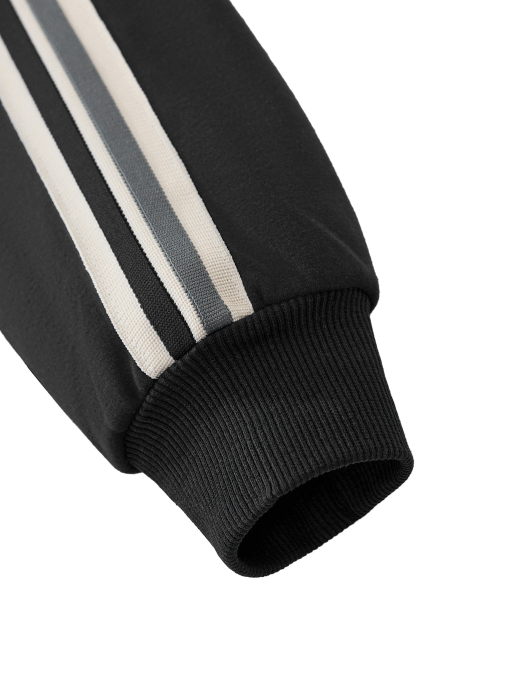 A black zip-up track jacket with a white front zipper, white shoulder stripes, and a white 'PIT LANE CLOTHING' wing logo on the chest, hanging on a wooden hanger against a light gray background.