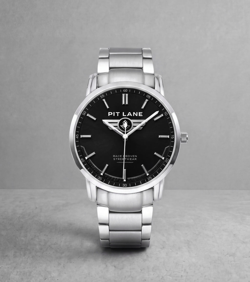A silver-tone Pit Lane Clothing wristwatch with a black dial and matching silver-tone metal link bracelet, centered against a neutral gray background.