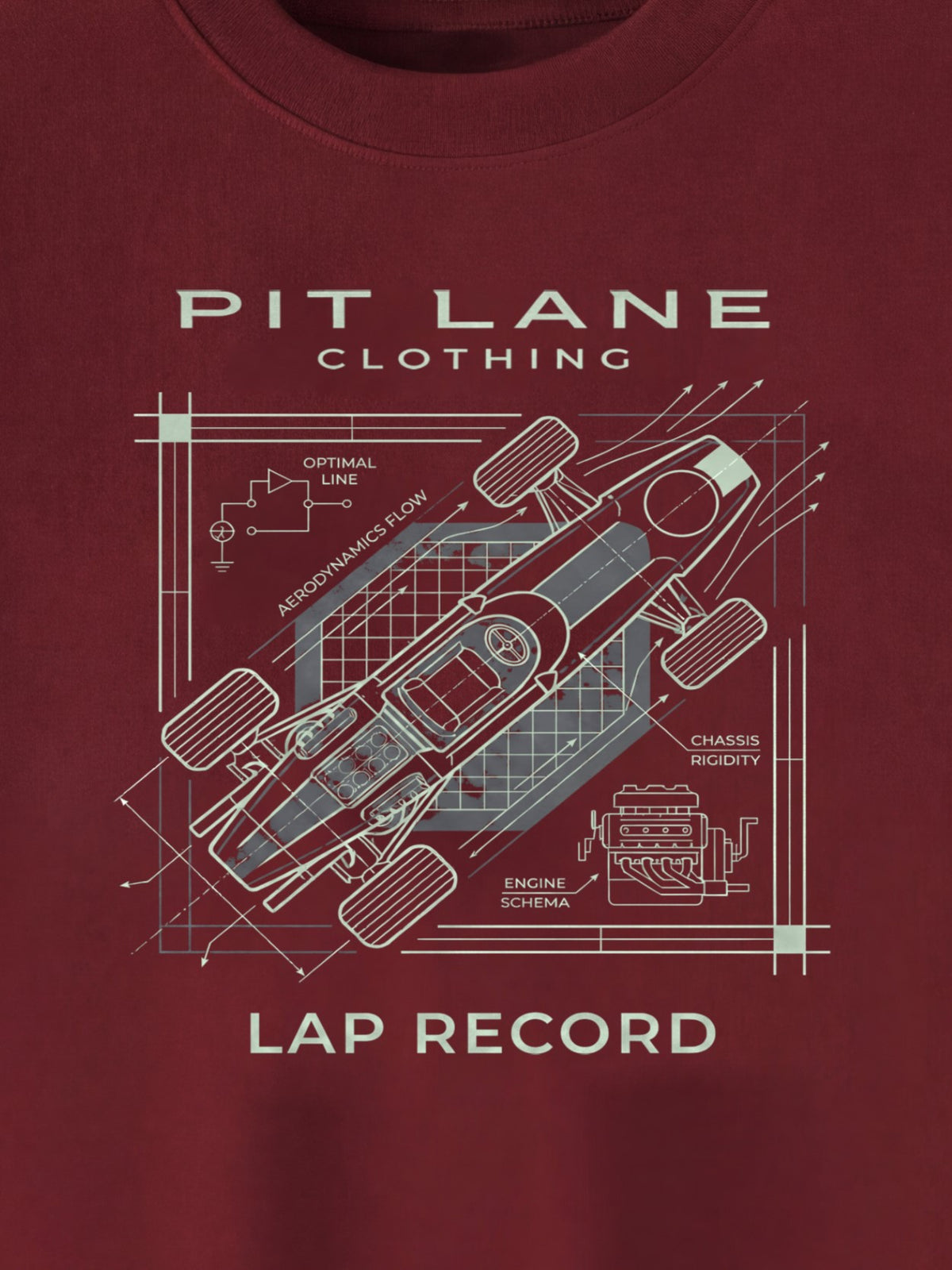 A close-up of a dark red crewneck t-shirt featuring a white blueprint-style graphic of a race car with technical annotations and the text 'PIT LANE CLOTHING' and 'LAP RECORD'.