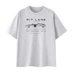 A light gray heather crewneck t-shirt featuring a black vintage race car graphic and the text 'PIT LANE CLOTHING' on the chest, displayed against a solid white background.
