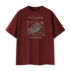 A dark red crewneck t-shirt with a white and gray graphic print on the front featuring a race car schematic and the text 'PIT LANE CLOTHING' and 'LAP RECORD'.