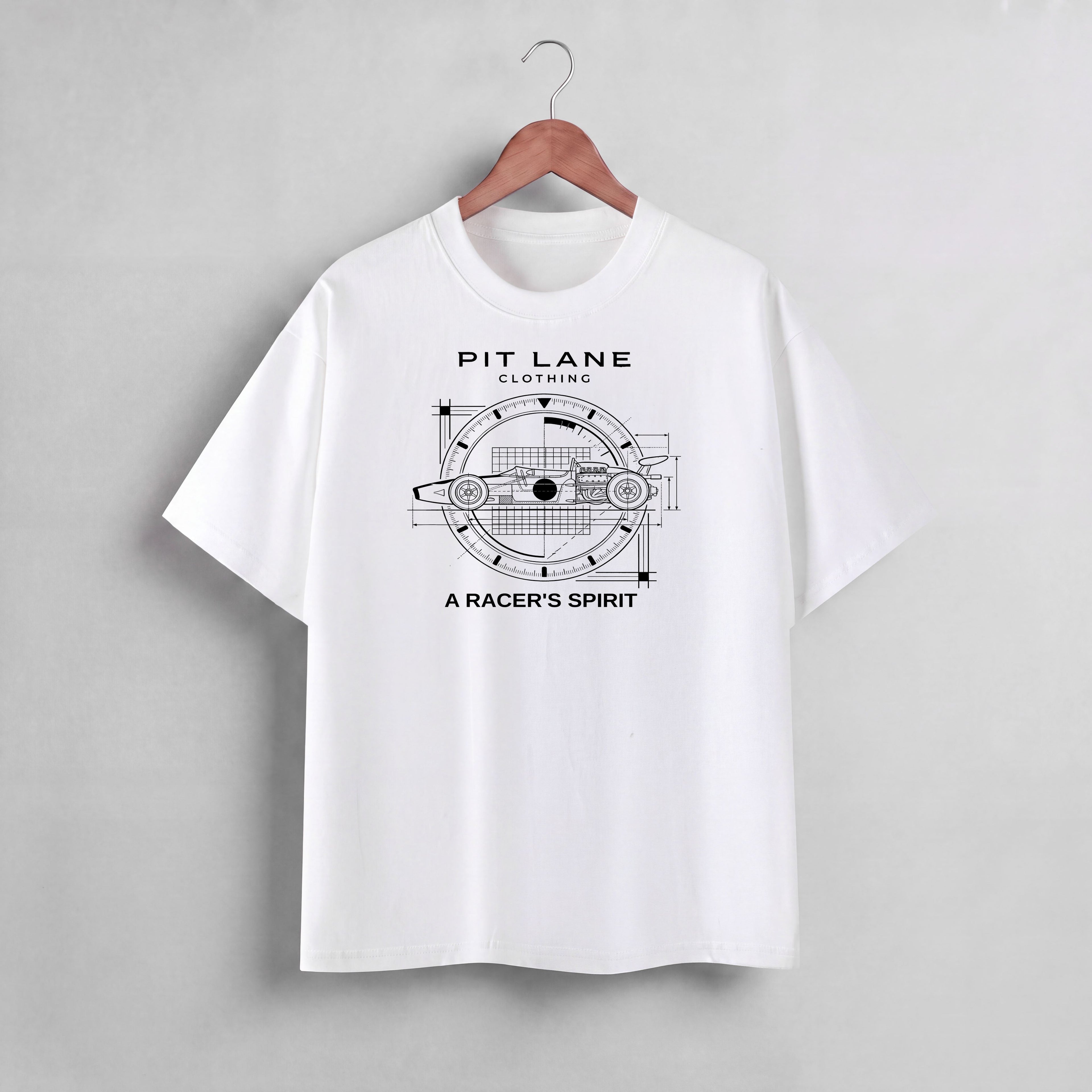 White short-sleeve t-shirt featuring a black graphic print of a race car in a technical blueprint design with the text 'PIT LANE CLOTHING' and 'A RACER'S SPIRIT'.