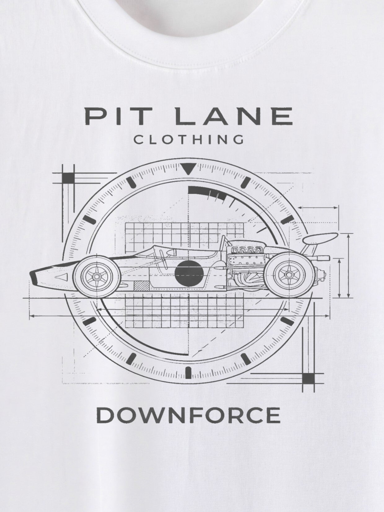 White short-sleeve t-shirt featuring a black technical blueprint-style graphic of a race car inside a circular clock-like frame, with the text 'PIT LANE CLOTHING' above and 'DOWNFORCE' below.